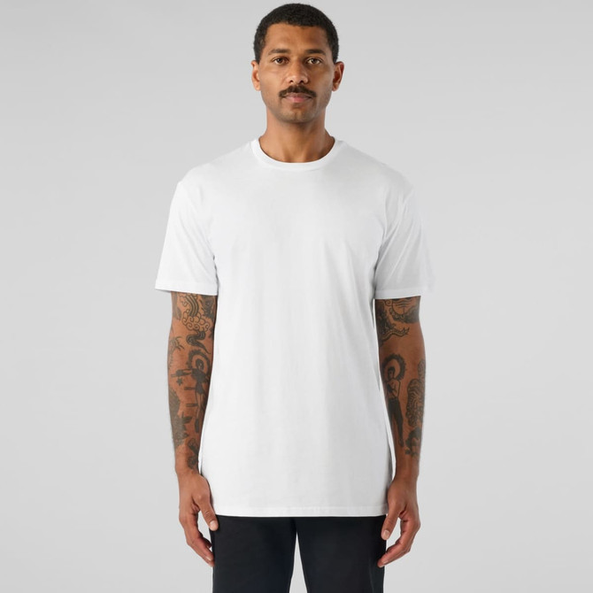 A white basic tee displayed on a model with tattoos, featuring a simple design and relaxed fit.