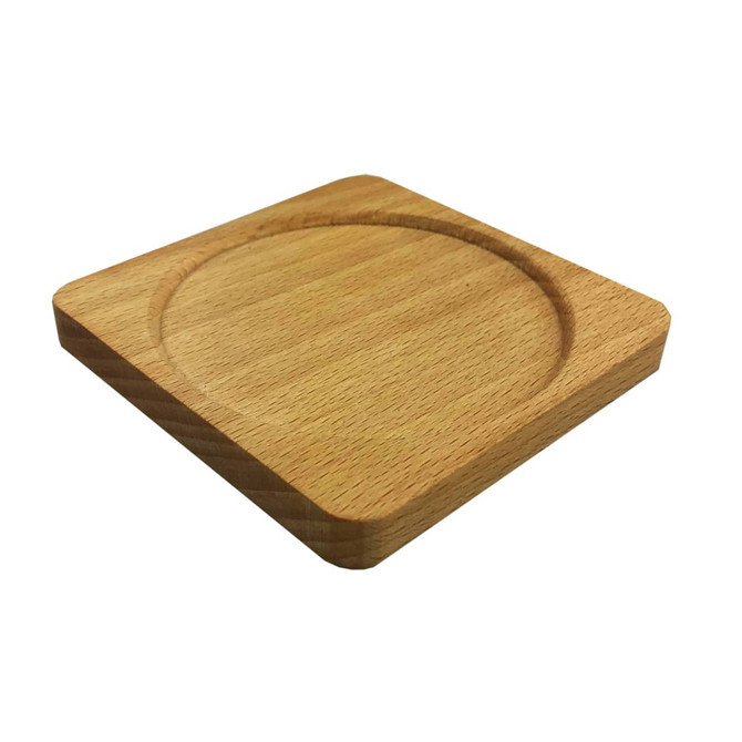 A square wooden coaster in natural beech with a circular recess. The surface appears smooth and polished, featuring rounded edges.