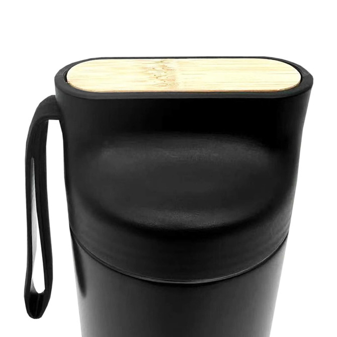 A drink bottle in matte black with a bamboo top and a side loop for easy carrying.