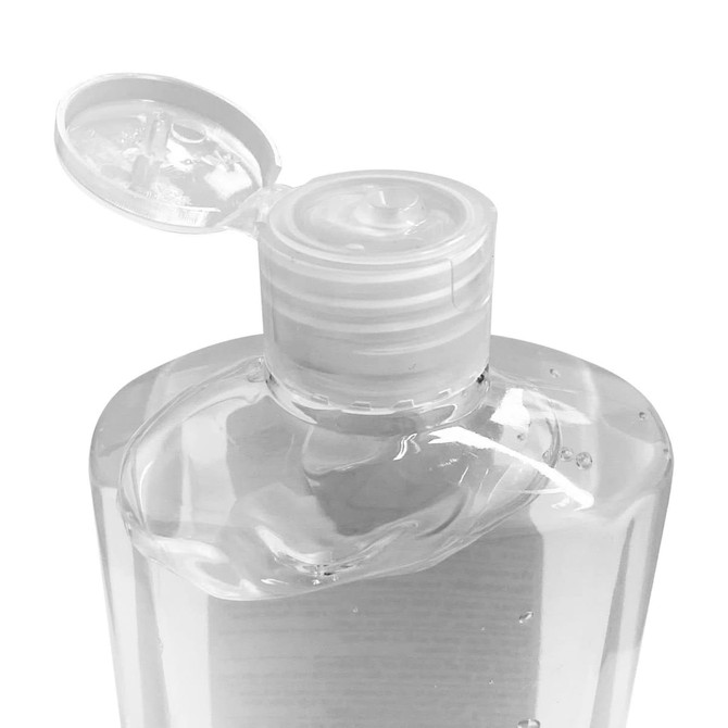A clear plastic bottle of hand sanitiser gel with a flip-top lid, containing 75% alcohol.