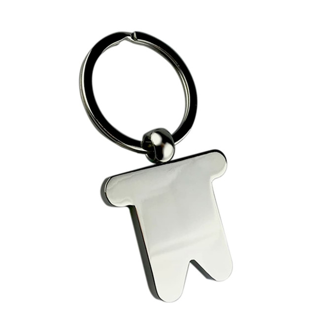A silver key ring shaped like a little character, featuring a smooth, shiny finish and a circular attachment.