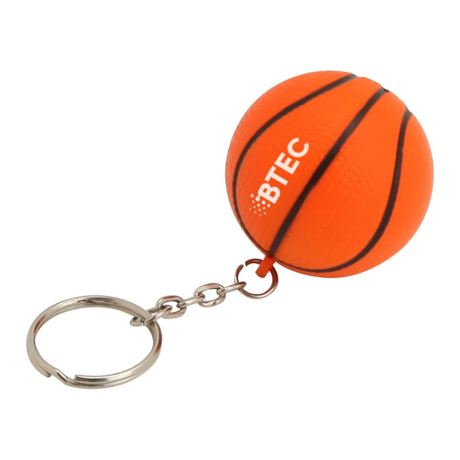 An orange basketball-shaped key ring with black stripes and a small branding logo.