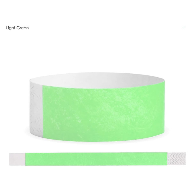 A light green Tyvek adult wristband with a decorative white end. Features a logo or branding.