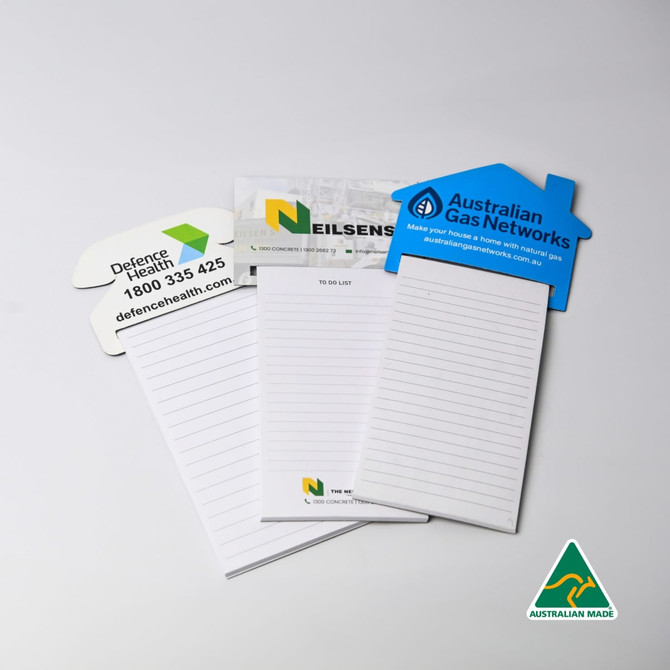 A set of house-shaped magnetic to-do lists in white with green and grey accents, featuring various branding logos.