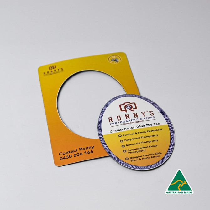 A magnetic photo frame in yellow with a circular cut-out, featuring a round promotional card with contact details.