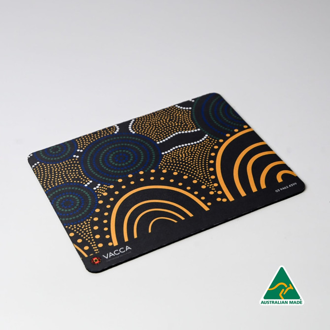 A mouse mat featuring an indigenous-inspired design with vibrant patterns in blue, orange, and white. It has a logo.