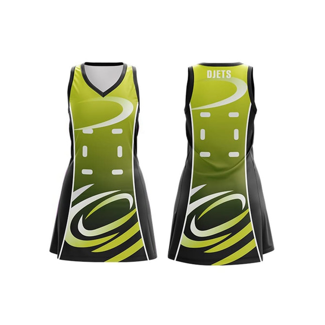 A Women's A-line netball dress in green and black with a graphic design and a logo on the front and back. A Women's A-line netball dress in green and black with a graphic design and a logo on the front and back.