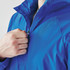 A blue 1/4 zip anorak jacket with a high collar, featuring a zip closure and a hand near the zipper.