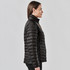A black women's thermal jacket with a quilted design, featuring a high collar and a side view of the model.