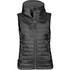 A black women's thermal vest with a hood and multiple zippered pockets. It features a sleek, quilted design and has a logo.