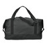 A black duffle bag features dual handles and a detachable shoulder strap, with an adjustable buckle and a branding logo.