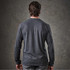 A long-sleeve henley shirt in dark grey, featuring a simple design and a logo on the back.