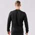 A men's long-sleeve Henley shirt in dark grey, featuring a simple design and fitted silhouette.
