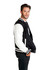 A men's varsity jacket in black with white sleeves, featuring a logo. Model is posing in profile.
