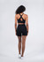 A pair of women's high-rise legging shorts in black, modelled from the back, featuring a logo on the waistband.