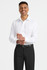 A white long sleeve button-up shirt displayed on a model wearing black trousers and a belt. The shirt features a logo.
