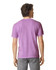A man wearing a purple heavyweight t-shirt, viewed from the back, with grey pants. The shirt has a logo on it.
