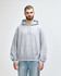 A grey hooded sweatshirt with a front pocket and a drawstring hood, featuring a branded logo.
