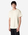 A plain cream Gildan Ultra Cotton adult T-shirt displayed on a model, featuring short sleeves and a round neckline.