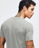 A grey fine jersey short sleeve t-shirt featured on a person from the back, showcasing the garment's fit and style.