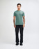 A unisex fine jersey short sleeve t-shirt in teal, paired with beige cargo pants, worn by a model.