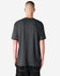 A unisex CVC short sleeve t-shirt in dark grey, featuring a simple design and a plain back view.