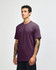 A unisex short sleeve t-shirt in a deep purple colour, featuring a simple design and a logo.