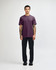 A unisex short sleeve T-shirt in a deep purple colour, paired with black cargo pants, featuring a logo.