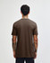 A unisex short sleeve T-shirt in brown, featuring a simple design and no visible logos on the back.