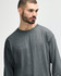 A long sleeve T-shirt in a charcoal grey colour, featuring a relaxed fit and minimal branding.