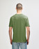 A green Gildan Softstyle adult T-shirt viewed from the back, featuring a simple design and a relaxed fit.