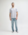 A grey Gildan Softstyle adult t-shirt with a straight back design, displayed on a model.