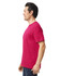 A vibrant pink Gildan Softstyle adult T-shirt displayed on a male model from the side, showcasing its relaxed fit.
