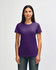 A purple ladies' t-shirt is displayed on a model. The shirt features a logo on the front.