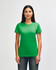 A green Gildan Softstyle ladies' T-shirt displayed on a model, featuring a classic crew neck and short sleeves.