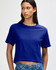 A woman wearing a blue boxy t-shirt, styled with denim shorts, featuring a branded logo.