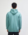 A unisex hooded sweatshirt in a soft green colour, featuring a spacious hood and a relaxed fit.