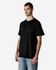 A model wearing a black Gildan Light Cotton T-Shirt paired with jeans, featuring a logo on the shirt.