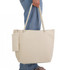 A canvas tote bag in cream with rope handles, featuring a zippered pouch attached.