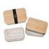 A bamboo-lid lunch box in natural tones, featuring a removable tray with utensils and a black elastic strap.