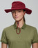 A beige bucket hat with a chin strap and a branded logo, featuring a wide brim for sun protection.