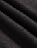 A close-up of dark grey polar fleece fabric with a soft, textured surface.