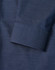 A close-up of a navy men's button-up shirt featuring a pin dot pattern and a cuff detail.