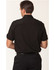 A men's short sleeve military shirt in black, featuring a button-up design and rolled sleeves. It has a logo.