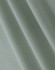 A close-up of light green cotton fabric with a smooth texture, showcasing fine weaves and folds.