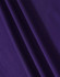 A close-up of fabric in a rich purple hue, showcasing the texture and depth of the material.