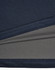 A close-up of a navy blue men's polo shirt featuring a textured fabric with a contrasting inner layer.