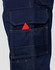 Navy blue semi-fitted Cordura work pants featuring multiple pockets, including a visible pocket with a red item.