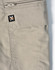 A pair of beige work shorts featuring a zip pocket and a logo patch. The fabric has a rip-stop texture.