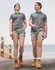 A pair of unisex cotton stretch drill short work shorts in light grey, worn by a male and female model.